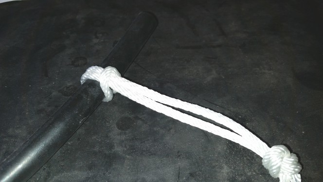 Rope loop, pull firmly and slip end with knot over head of nail